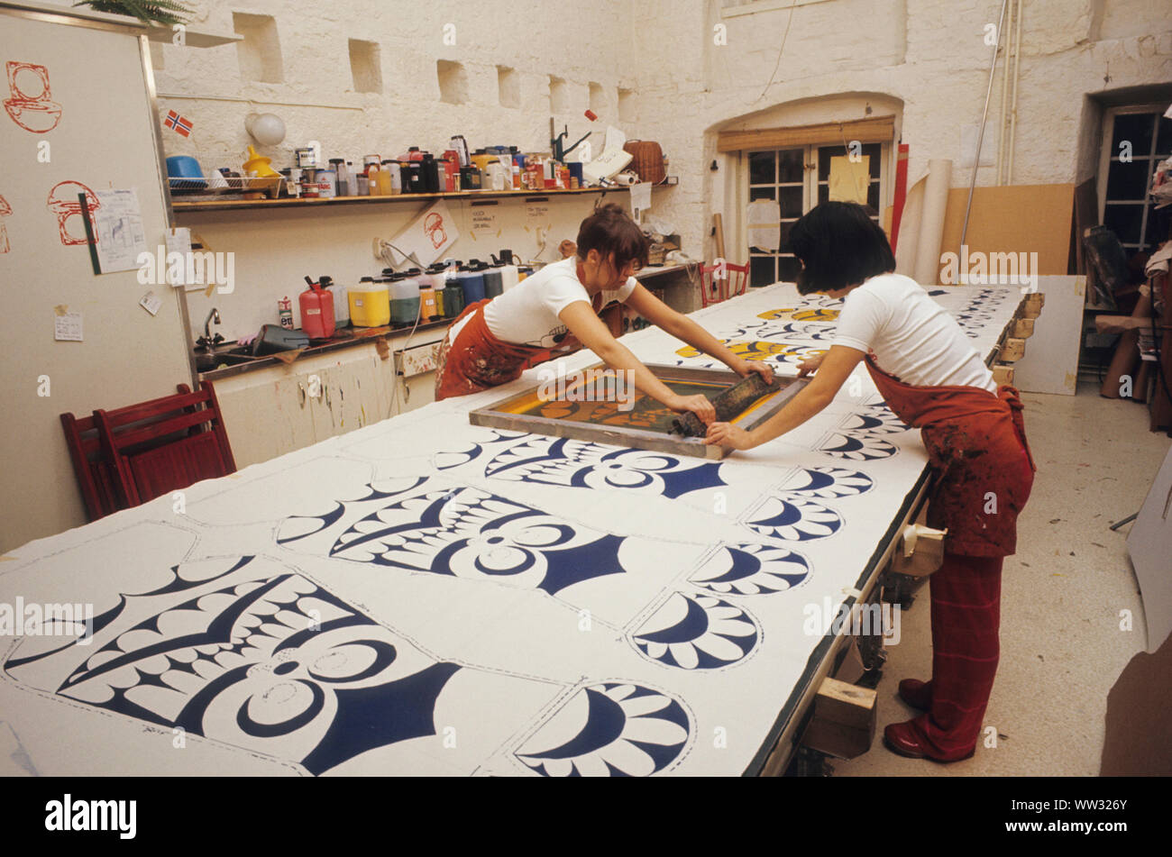 Women print on textile in studio Stock Photo