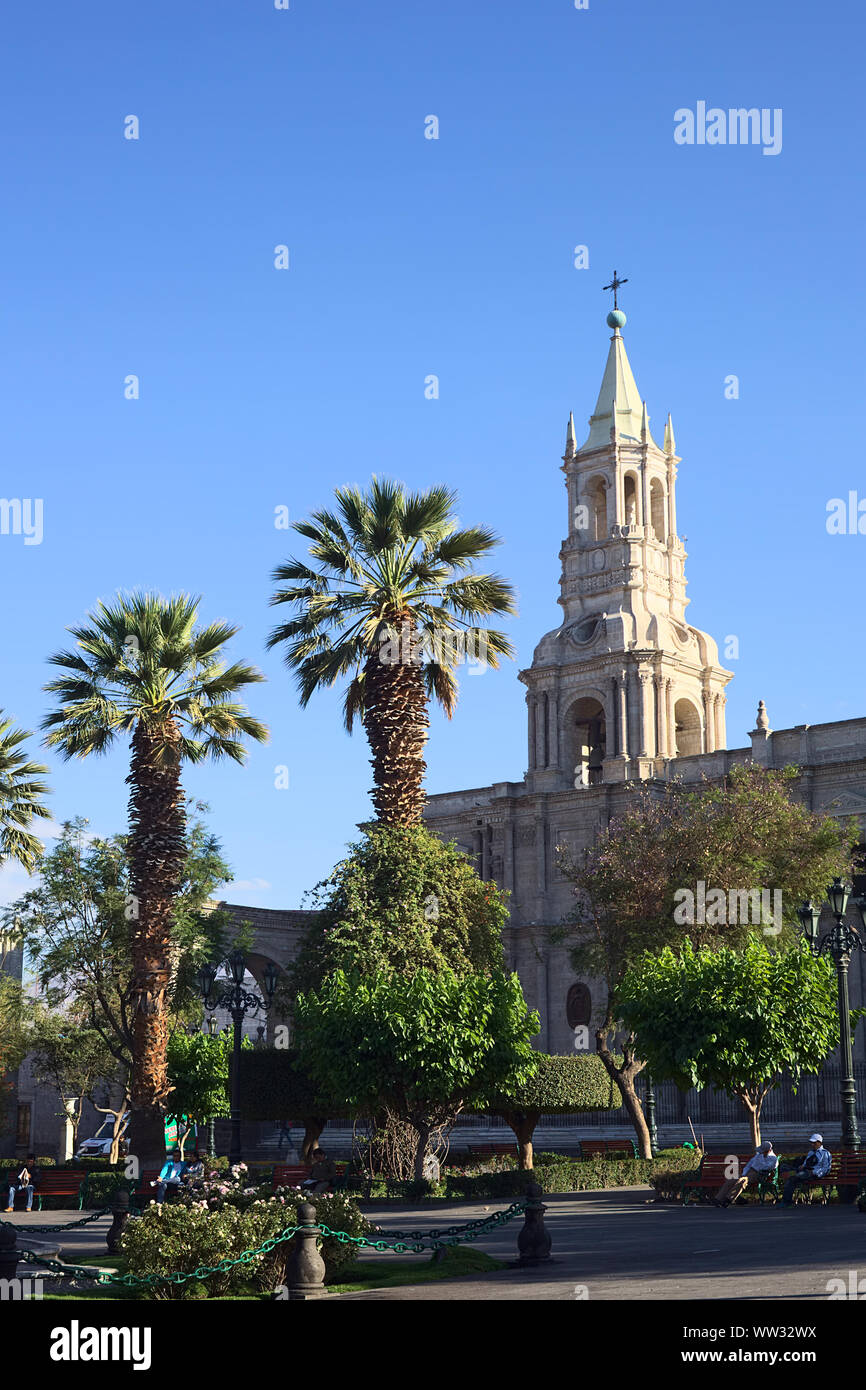 AREQUIPA, PERU - OCTOBER 8, 2014: Plaza de Armas (main square) and the Basilica Cathedral in the historical city center early in the morning Stock Photo