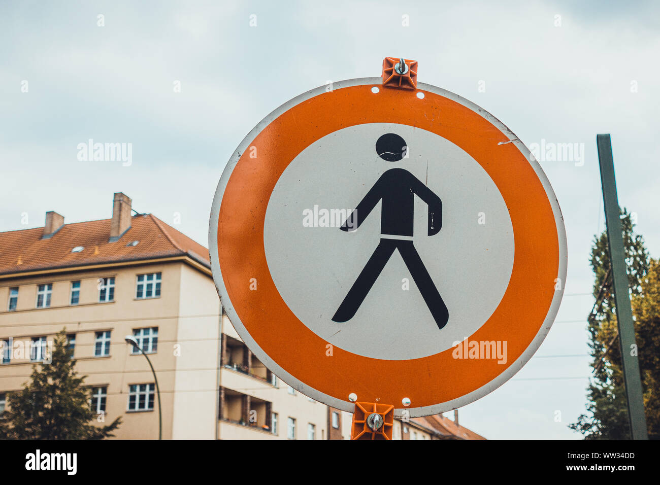 pedestrians traffic sign with cloudy background Stock Photo