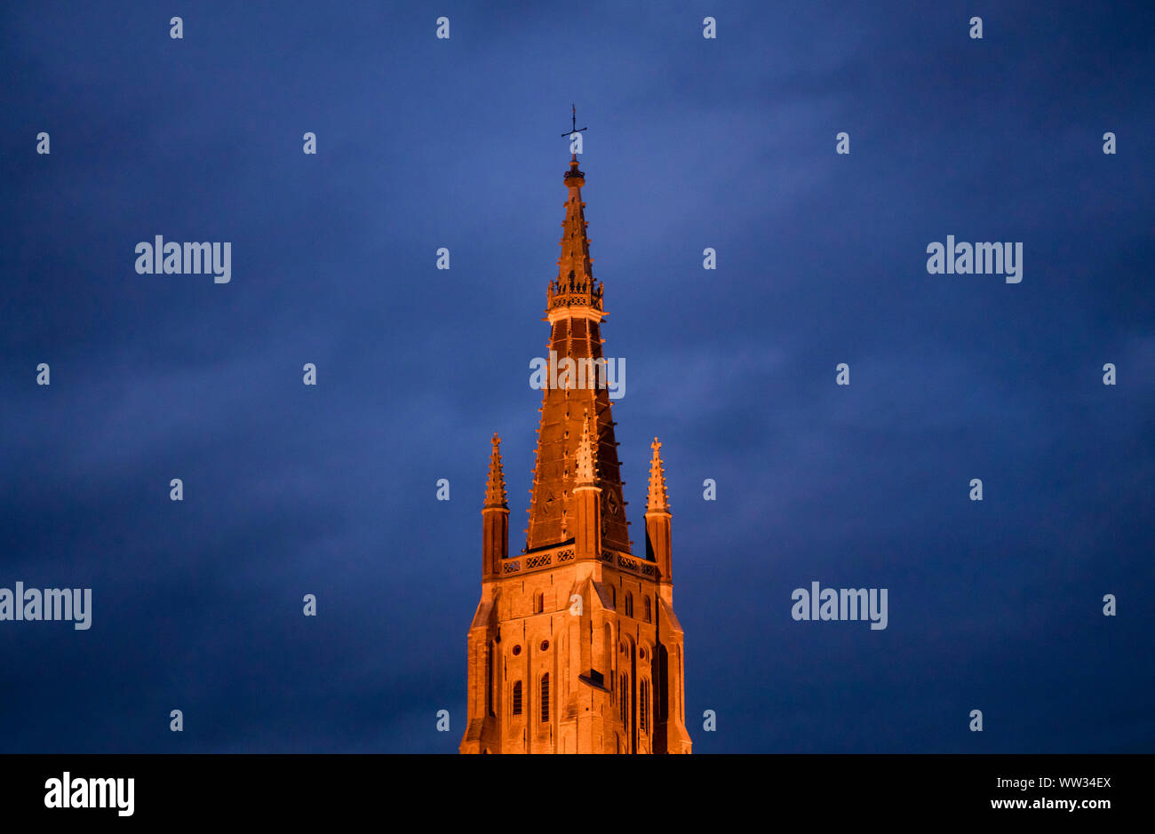 Belfry of the Church of our Lady, Bruges (Belgium). Nocturnal image Stock Photo