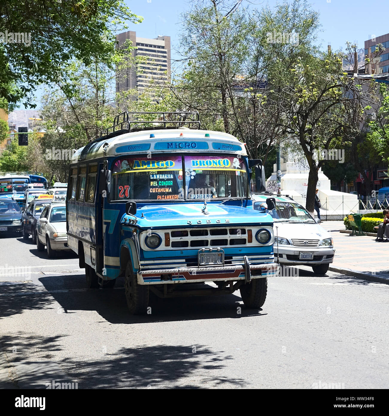 LA PAZ, BOLIVIA - OCTOBER 15, 2014: An old blue Dodge D400 bus used for public transportation driving on El Prado avenue in the city center Stock Photo