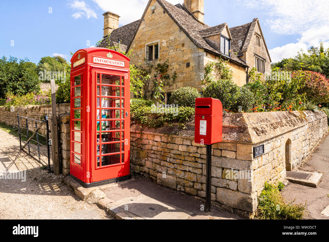 An old red telephone box now converted into an information point on the Cotswold Way in the Cotswold village of Stanton, Gloucestershire UK Stock Photo