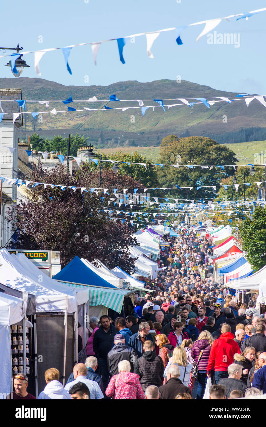 Glenties, County Donegal, Ireland. 12th September 2019. Crowds walk the main street in the small town during the annual Harvest Fair. The fair is the biggest of it's kind in Ireland and the main N56 road through the town is closed for the day with diversions in place. Stock Photo