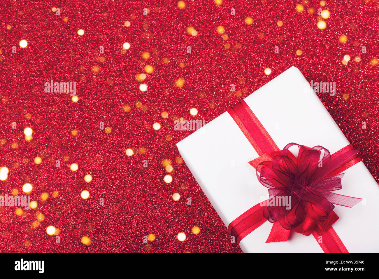 White gifts with red ribbon, present on white background. top view. Happy  Holidays. Valentine's day. Birthday. Merry Christmas and Happy New Year  Stock Photo - Alamy