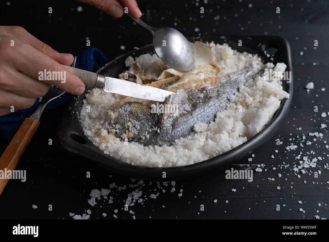 Be salt bream. Uncovering is fish after baking Stock Photo Alamy