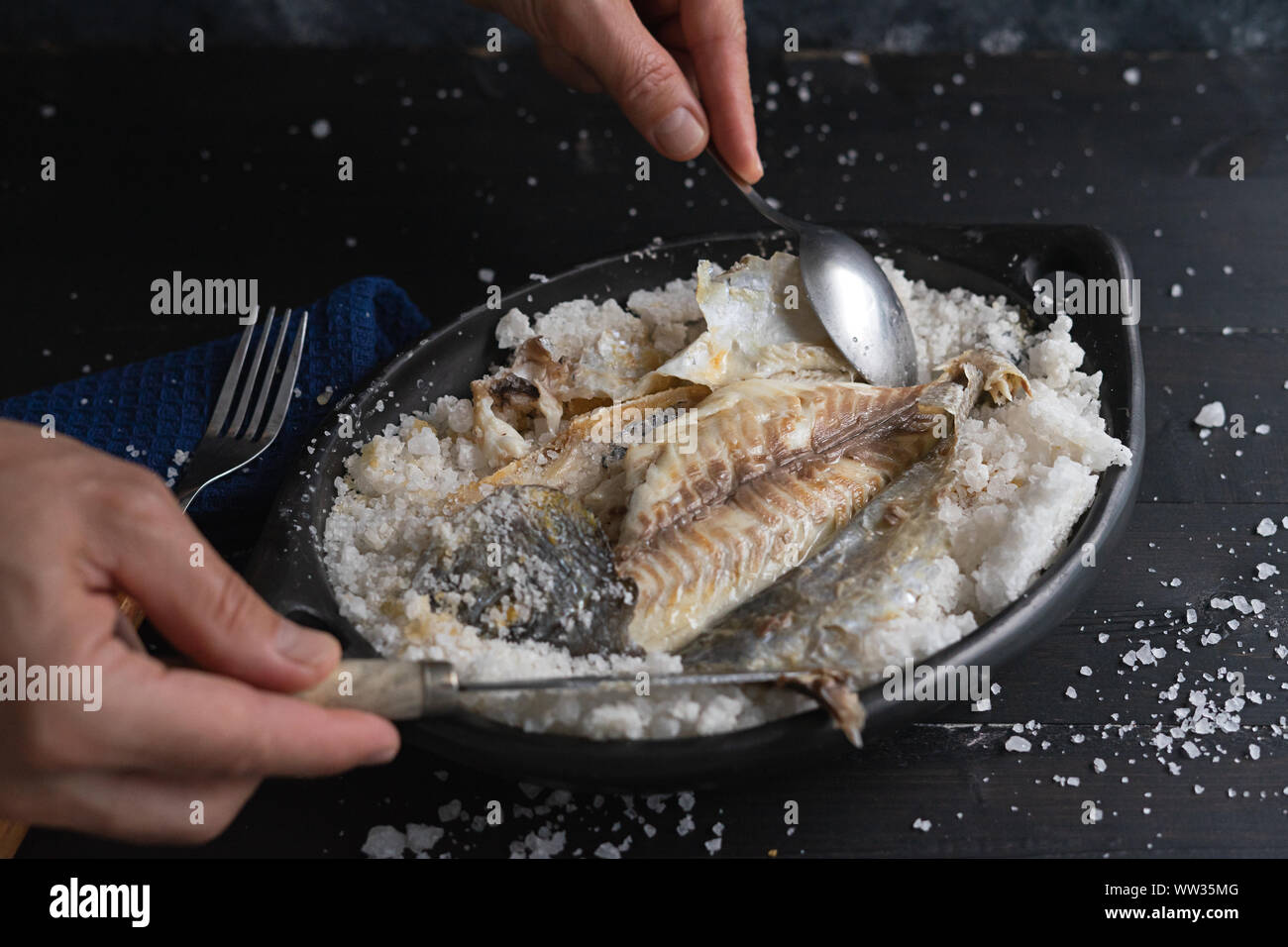 Be salt bream. Uncovering is fish after baking Stock Photo Alamy