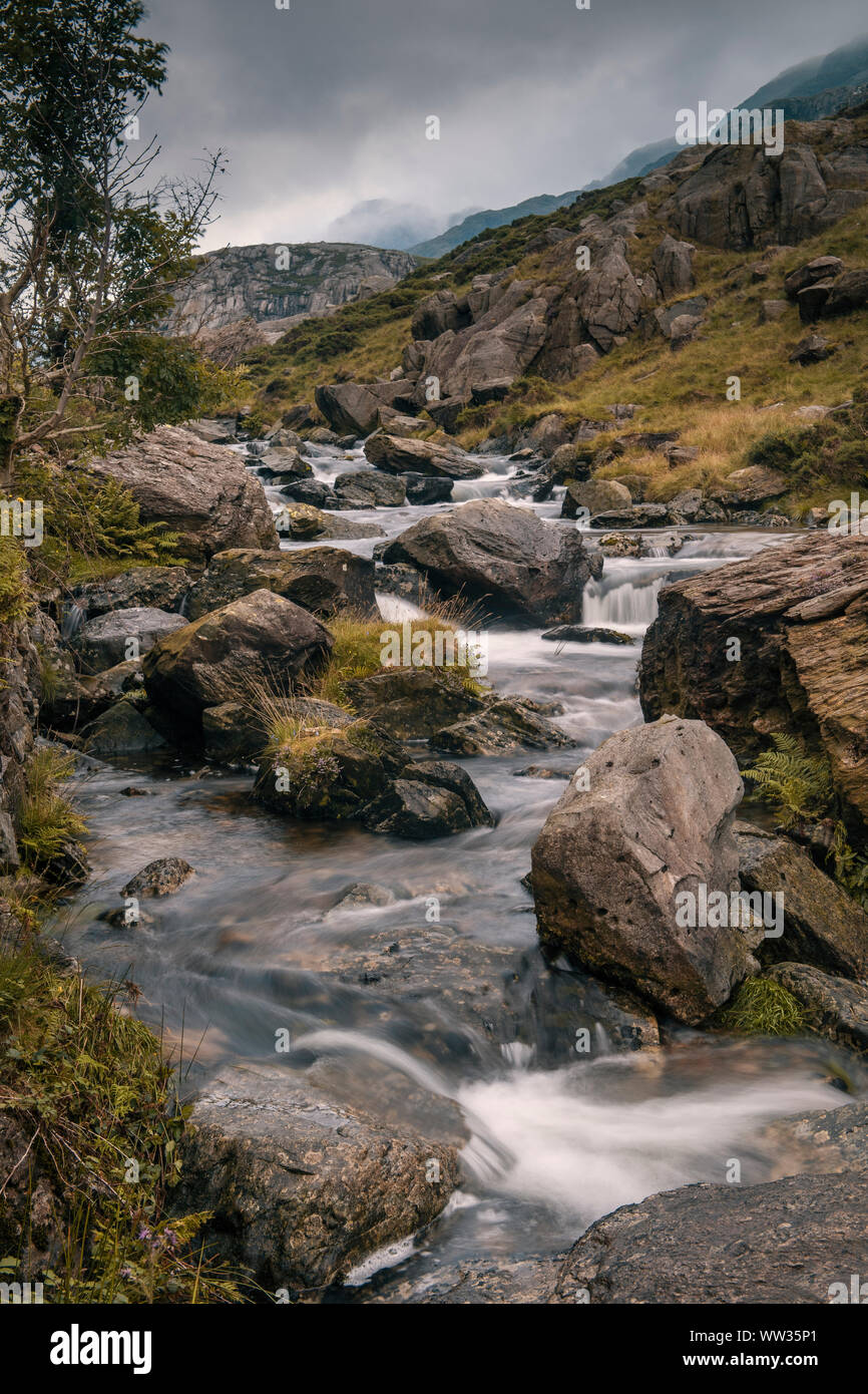 Afon Nant Peris river as it flows through the Llanberis pass in Gwynedd, North Wales Stock Photo