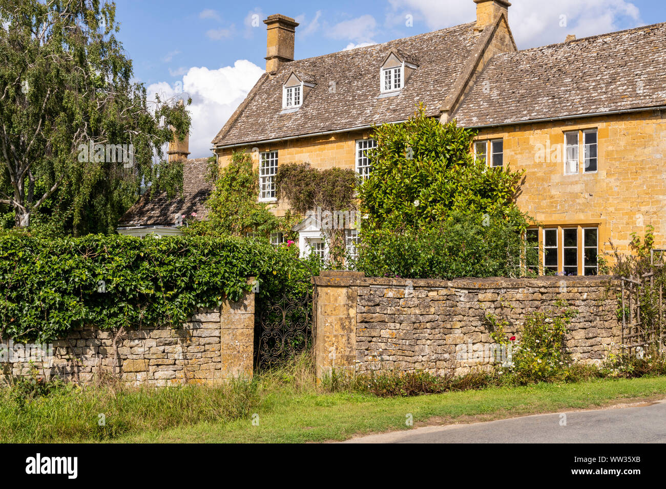 Cotswold stone houses in the village of Wood Stanway, Gloucestershire UK Stock Photo