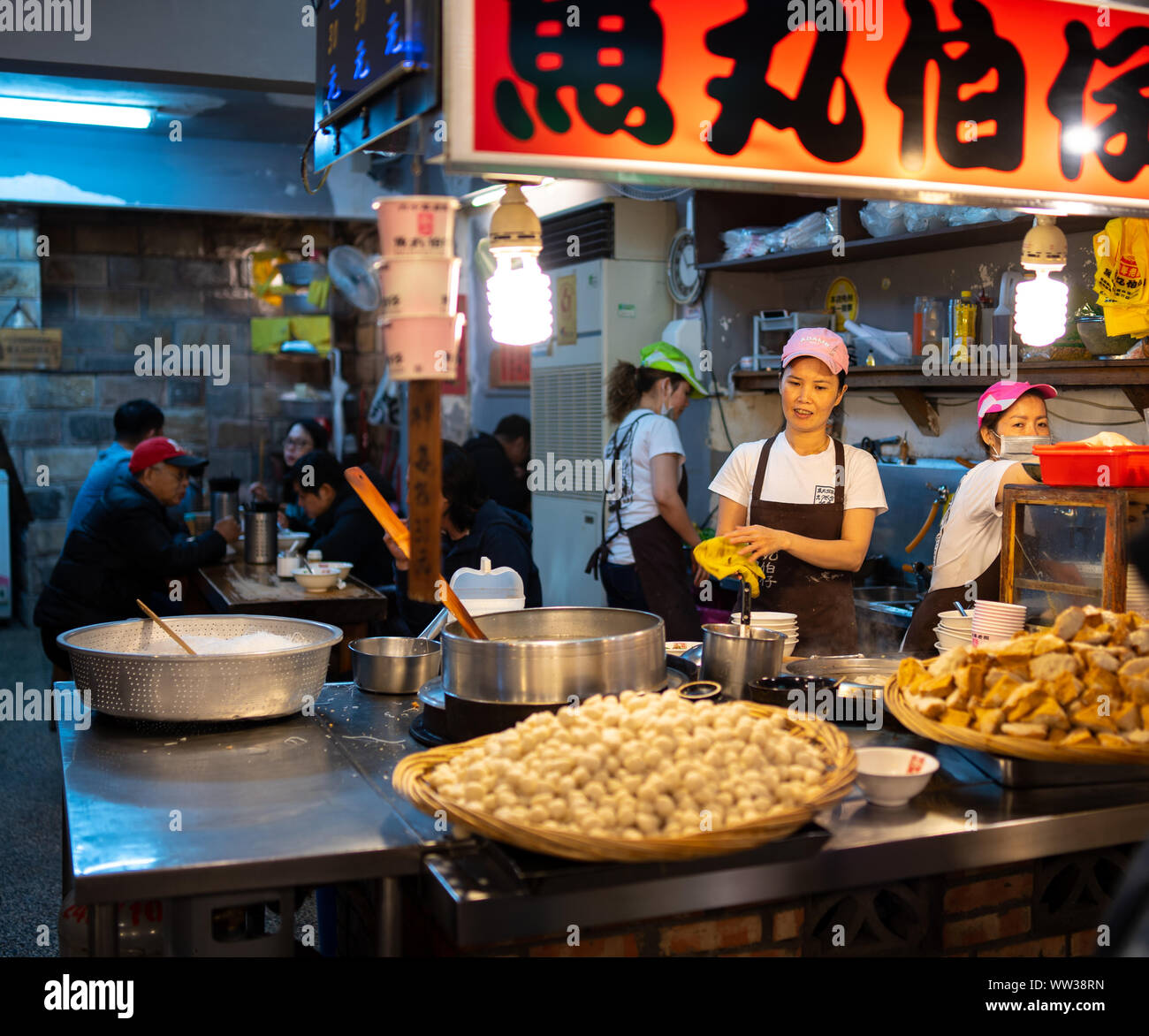 Taipei, Taiwan: Small, street restaurant in Jiufen selling rice vermicelli noodle soup with meatballs and tofu at night. Stock Photo