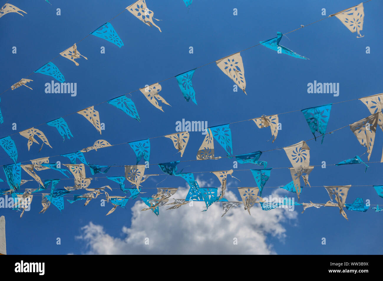 Decoration Of Blue And White Flags Hanging On The Streets Of