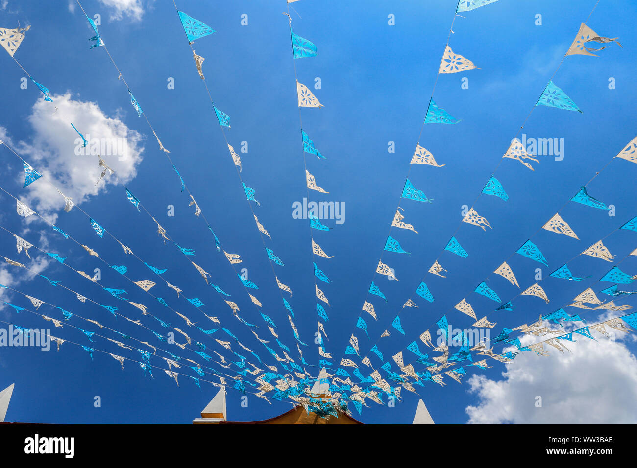 Decoration Of Blue And White Flags Hanging On The Streets Of