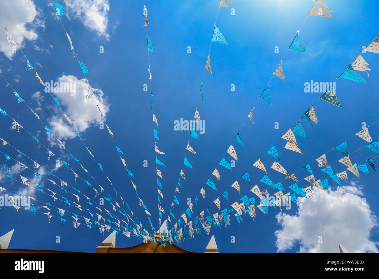Decoration Of Blue And White Flags Hanging On The Streets Of