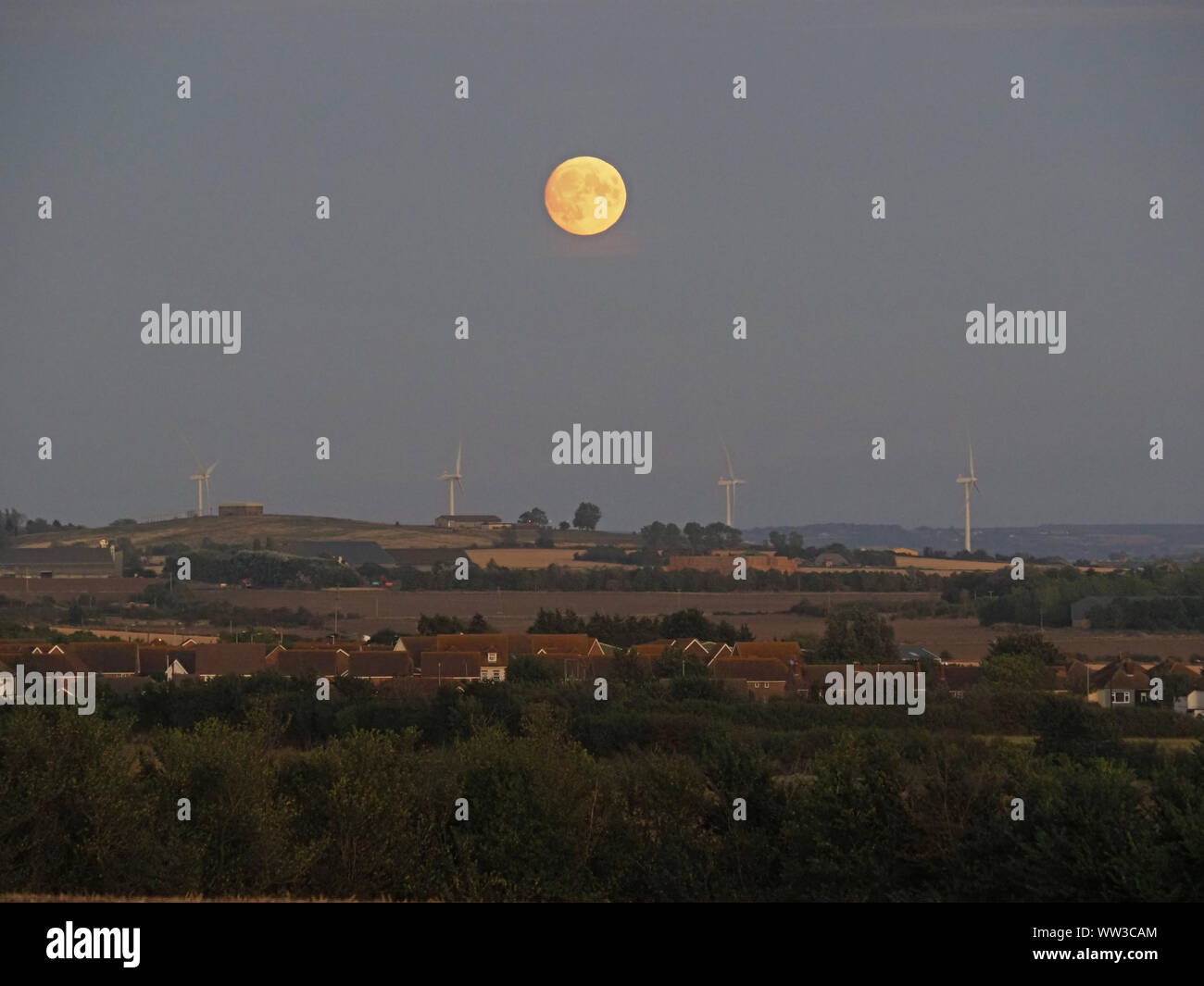 Halfway Houses, Sheerness, Kent, UK. 12th September, 2019. UK Weather: the 98% waxing gibbous moon rising over farmland on the Isle of Sheppey in Kent as seen from Halway Houses, Sheerness. Tomorrow will see a full moon - the first on Friday 13th for a number of years. The September full moon is known as the Harvest Moon. Credit: James Bell/Alamy Live News Stock Photo