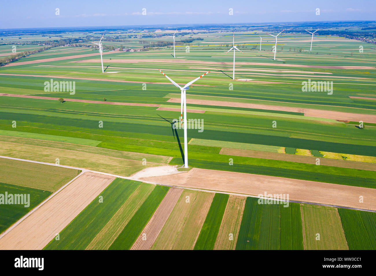 wind turbines among fields seen from above Stock Photo