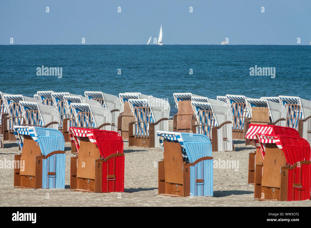 Germany beach chairs, Warnemunde Baltic sea summer beach Seaside strandkorb  Ostsee colorful chairs Stock Photo - Alamy