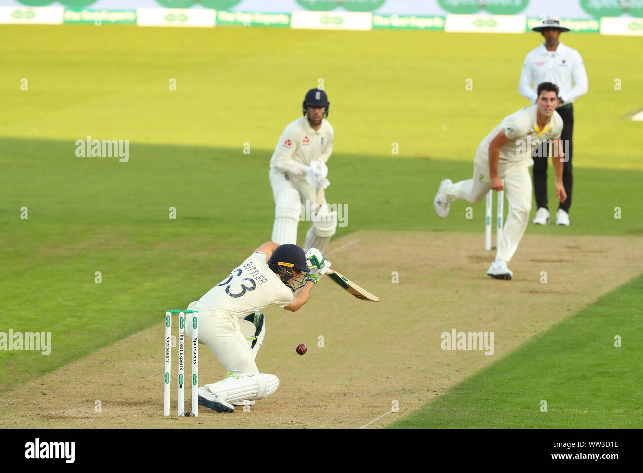 LONDON, ENGLAND. 12 SEPTEMBER 2019: Jos Buttler of England plays a shot as Pat Cummins of Australia bowls the ball during day one of the 5th Specsavers Ashes Test Match, at The Kia Oval Cricket Ground, London, England. Stock Photo