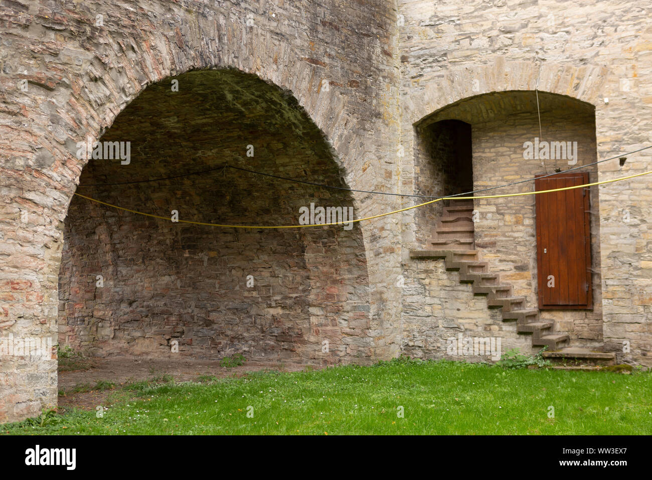 Architectural detail of the Wewelsburg castle with brick construction,  hidden staircase and door on the canal level Stock Photo