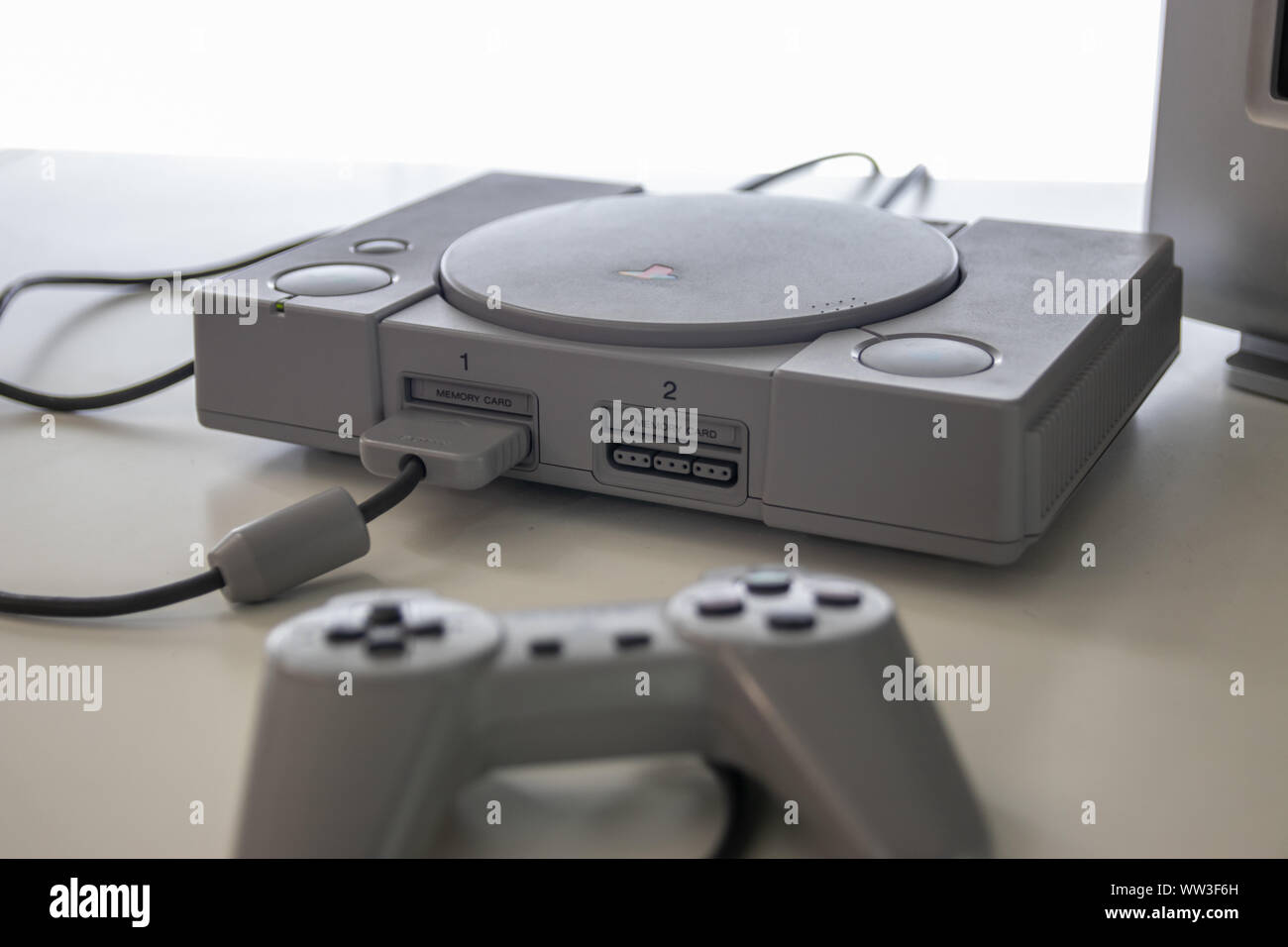 A Sony Playstation one and controller a games console released in 1994 by Sony Stock Photo