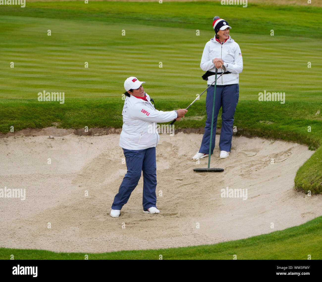 Auchterarder, Scotland, UK. 12th Sep, 2019. Final practice day at 2019 Solheim Cup on Centenary Course at Gleneagles. Pictured; Nancy Lopez demonstrates a bunker shot under watchful gaze of Juli Inkster. Credit: Iain Masterton/Alamy Live News Stock Photo