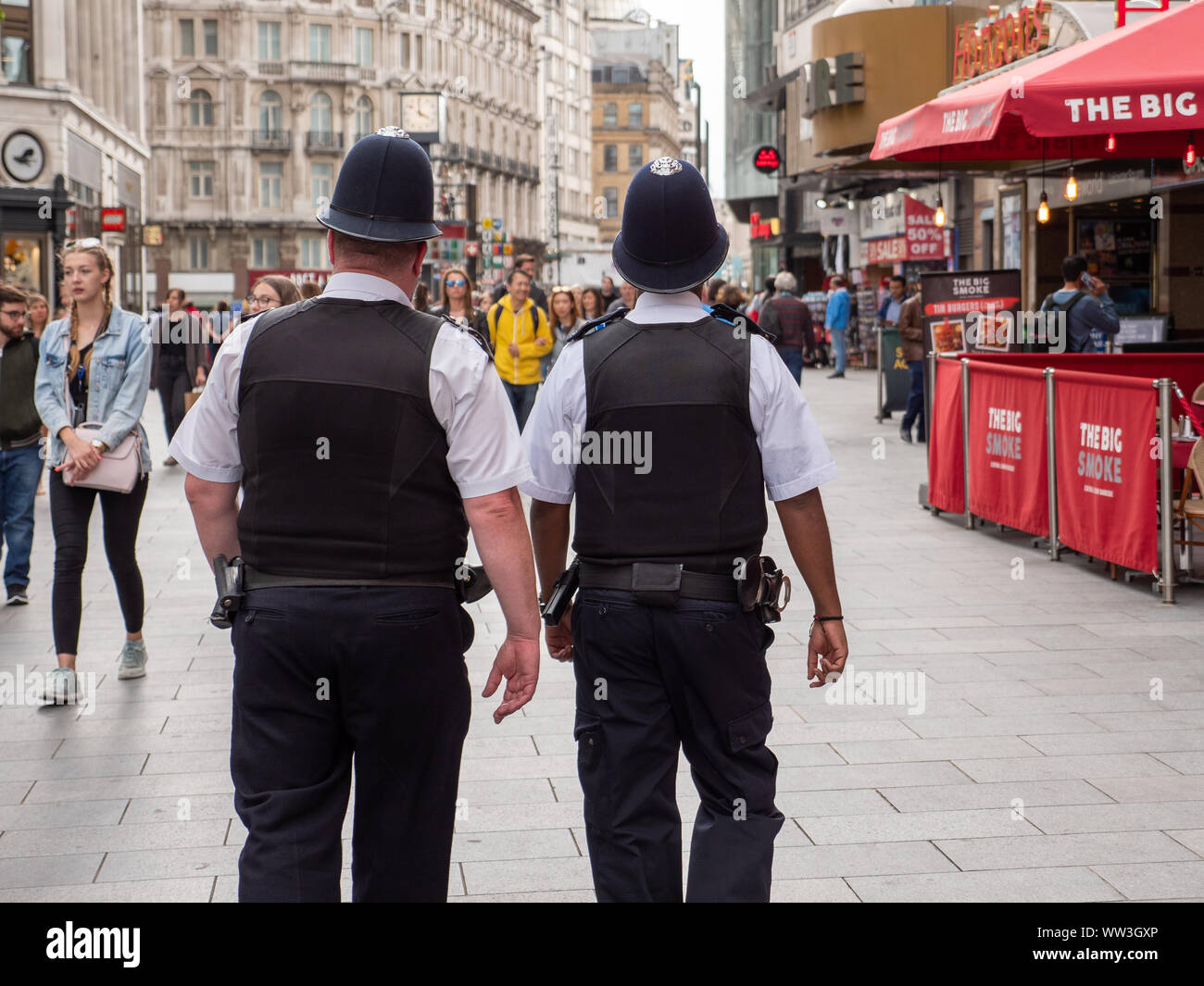 Two policemen on patrol in the West End, London, UK Stock Photo