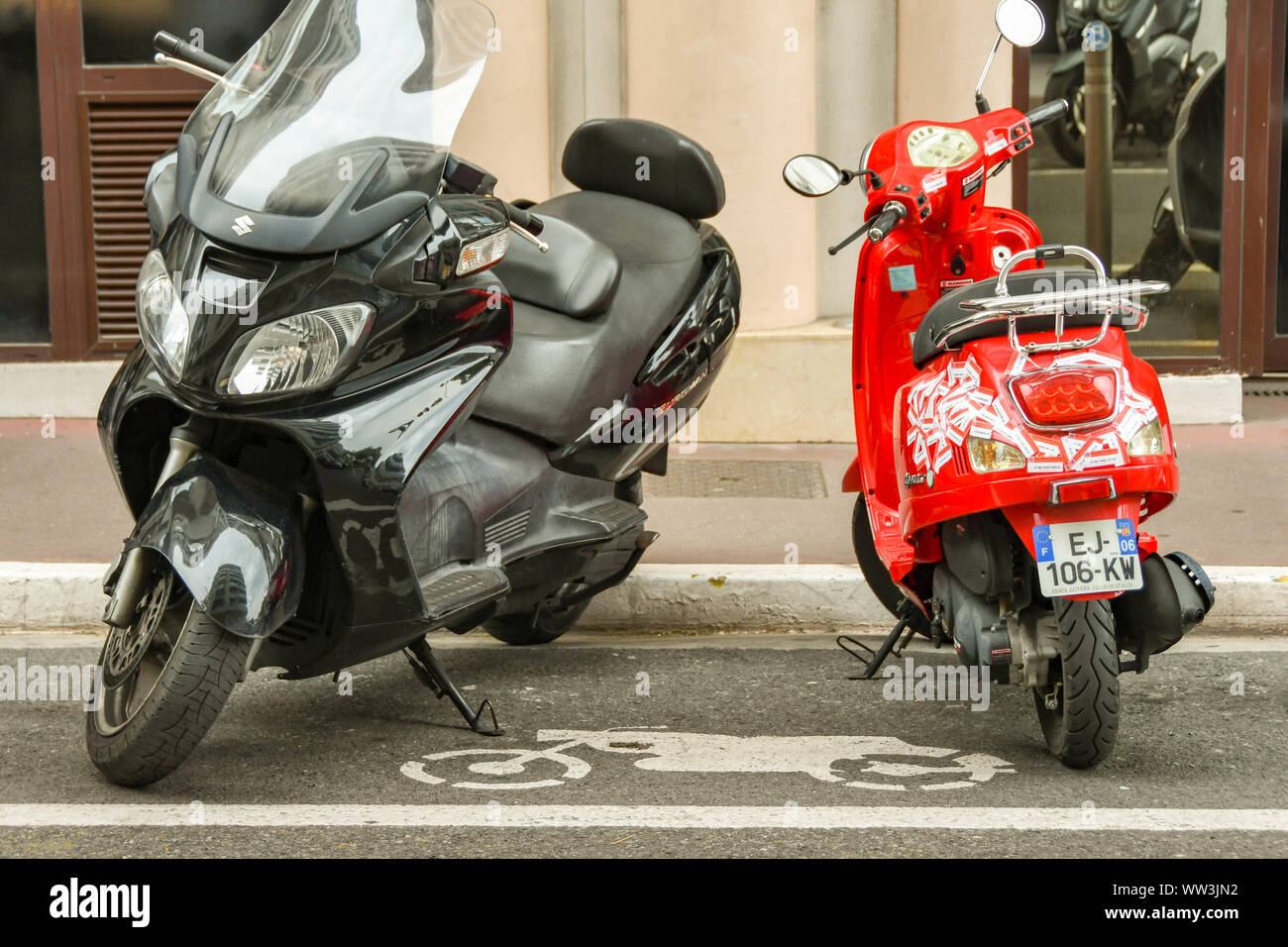 SAN RAPHAEL, FRANCE - APRIL 2019: Motorbike and motor scooter parked in a designated parking bay on a street in San Raphael. Stock Photo