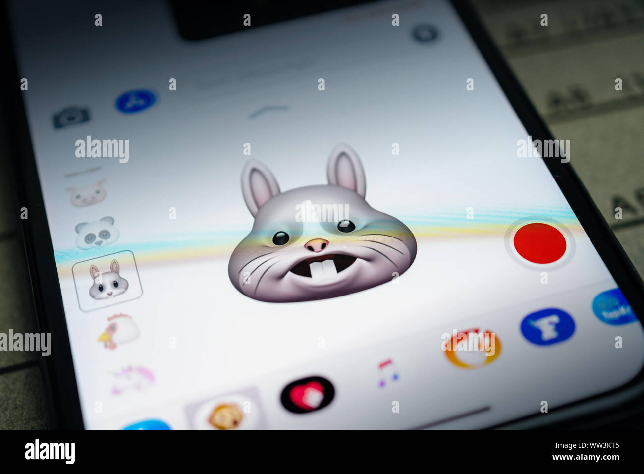 Paris, France - Sep 12, 2019: Latest iPhone 11 Pro featuring multiple Animoji character with face of rabbit expressing yelling face sentiments Stock Photo