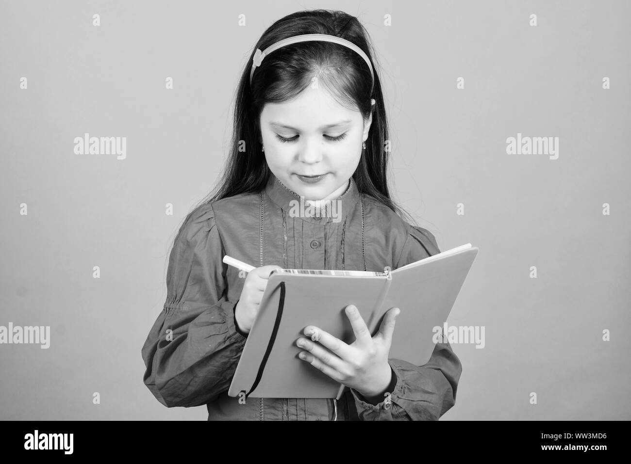 Kid writing book book concept development and education homework