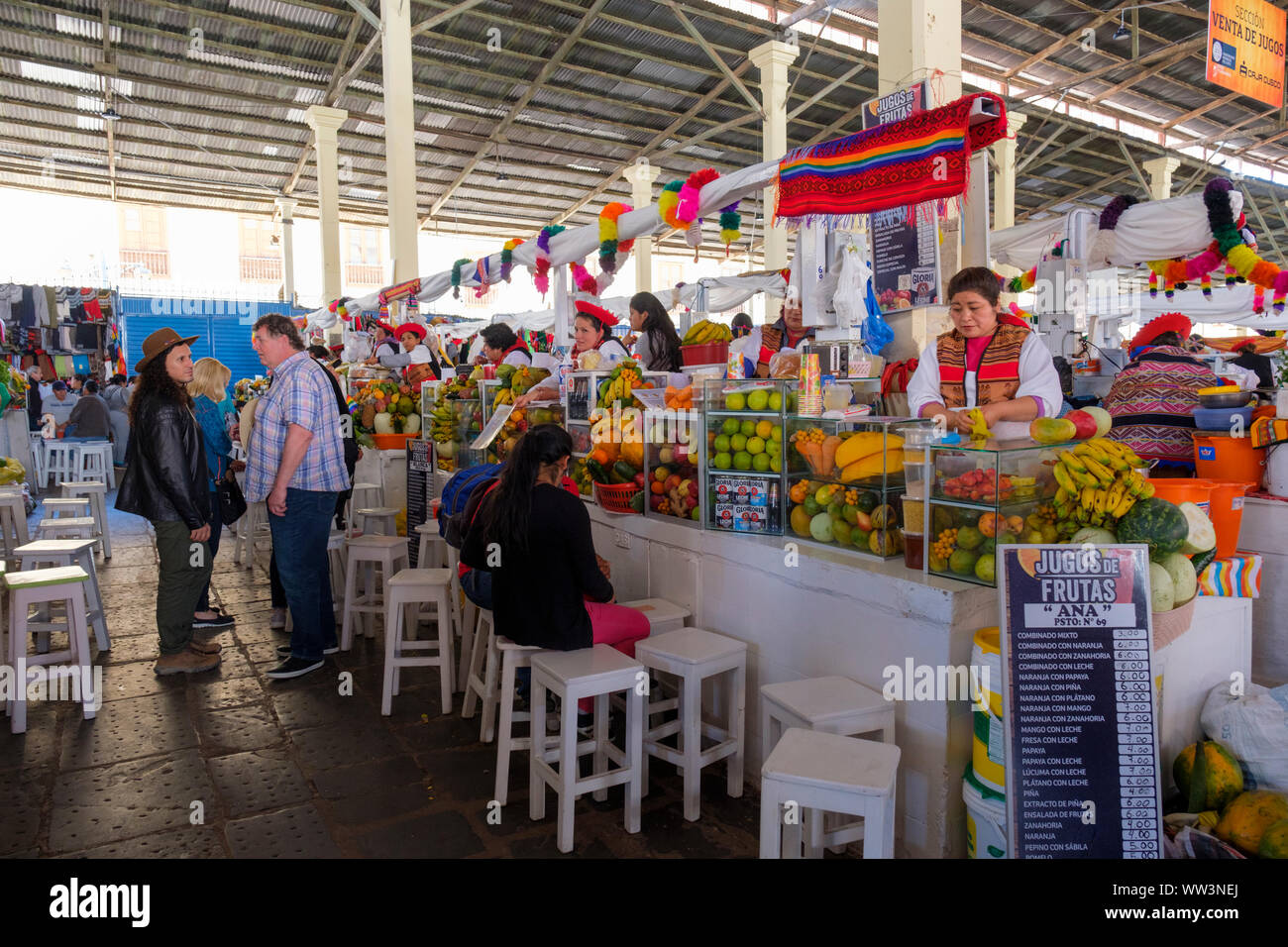 Peru food market, fresh juice stands inside San Pedro Market in the