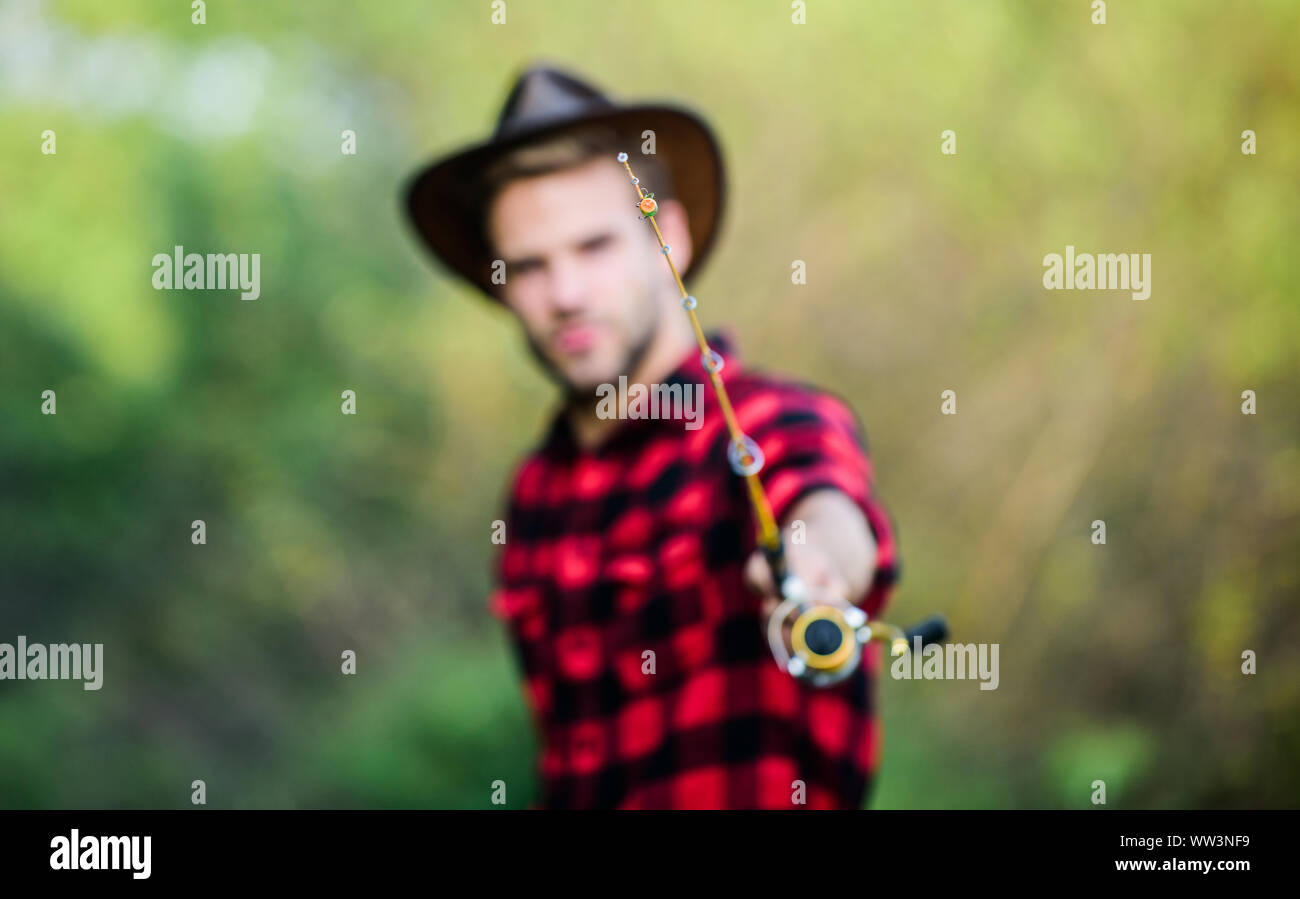 Casting off. serious man in cowboy hat. western portrait. Vintage style  man. Wild West retro cowboy. fly fishing. man checkered shirt on ranch.  fisher hold fish net. hobby. fisherman with fishing rod Stock Photo - Alamy