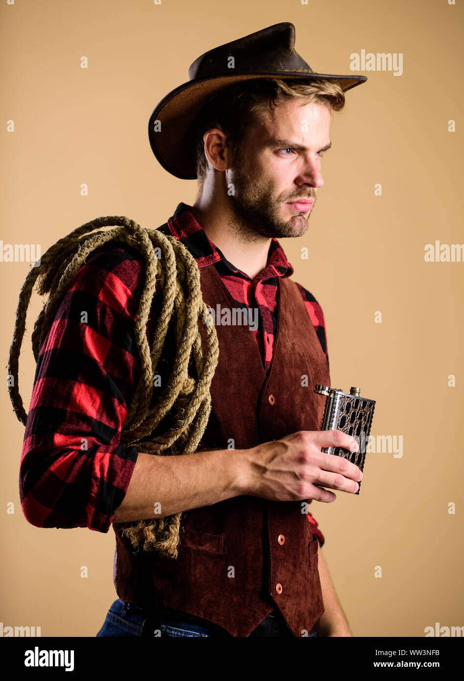 Sheriff concept. Bourbon whiskey. Western culture. Man wearing hat hold ...