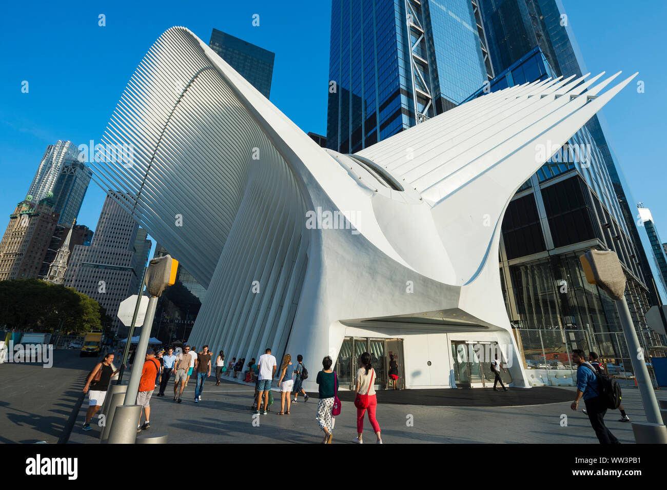 NEW YORK CITY - AUGUST 15, 2017: Visitors pass under the distinctive architectural form of the Oculus transportation hub at World Trade Center. Stock Photo