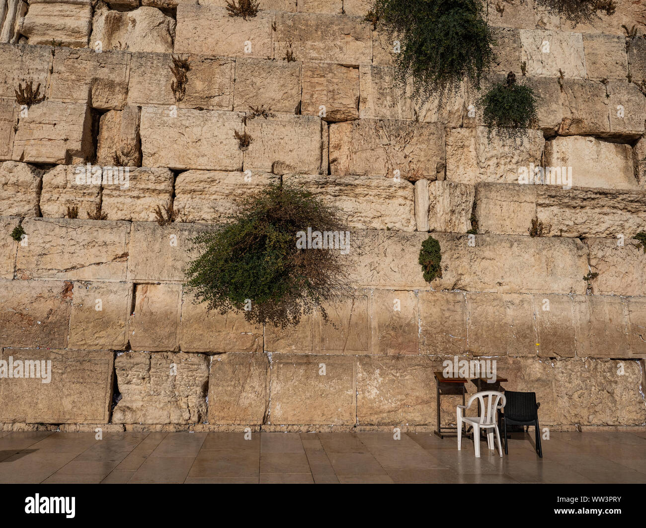 Israel historic religion Western Wall with two chairs for praying Stock Photo
