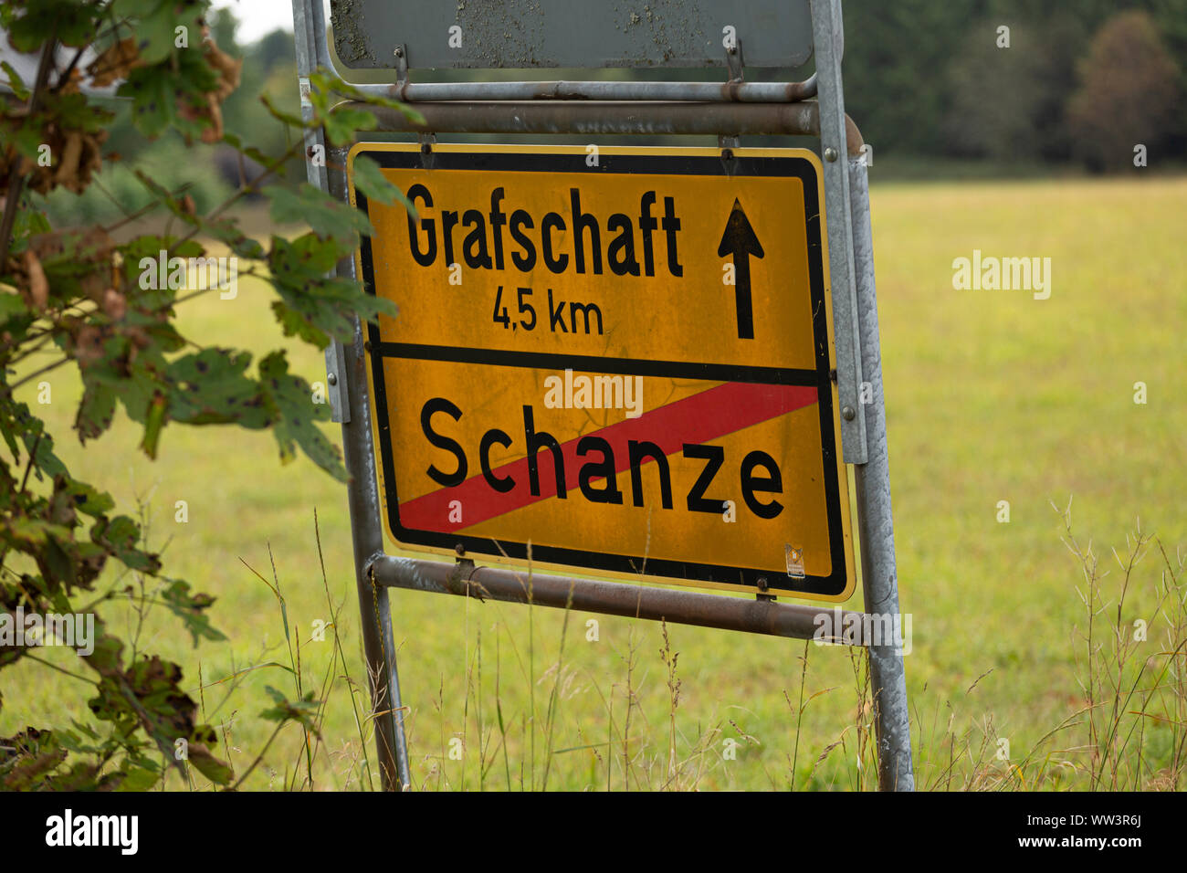 Winter sport area frontier sign at the end of ski resort of Schanze in the German Sauerland region with distance notification to the village Grafschaf Stock Photo