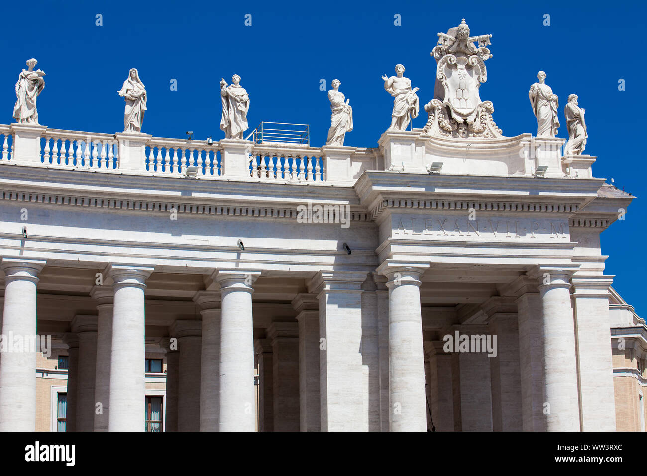 Detail of the Chigi coats of arms and the statues of saints that crown the colonnades of St. Peter Square built on 1667 on the Vatican City Stock Photo