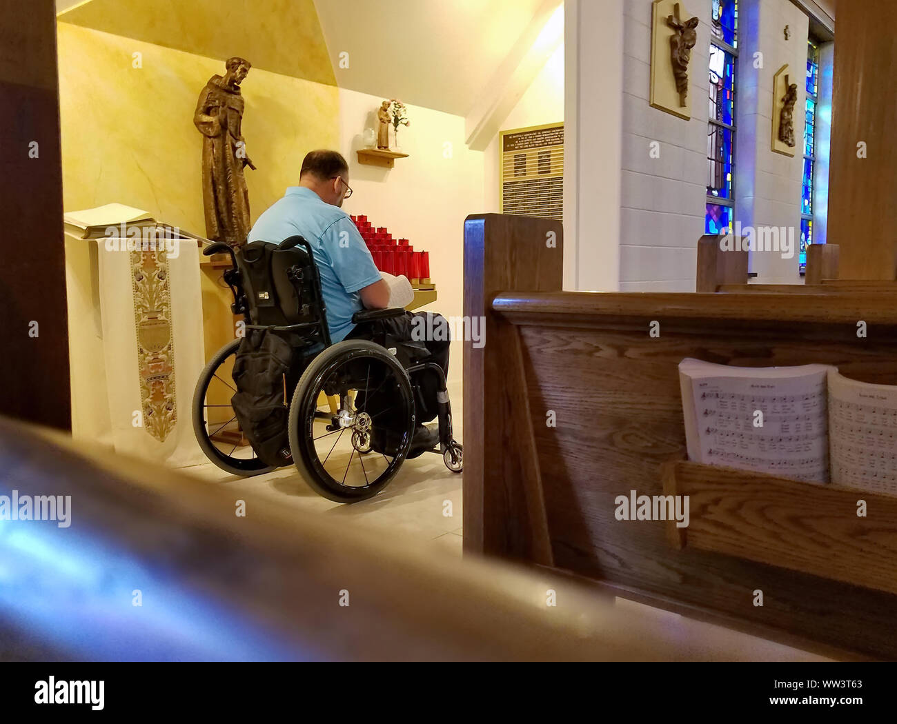 Middletown, CT USA. Sept 2019. Elderly man in a wheelchair at church participating in Sunday services. Stock Photo