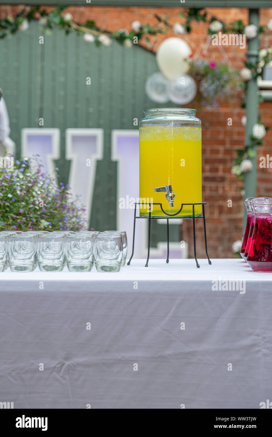 https://c8.alamy.com/comp/WW3TJW/chilled-party-lemonade-in-vintage-style-glass-dispenser-on-the-top-of-table-WW3TJW.jpg