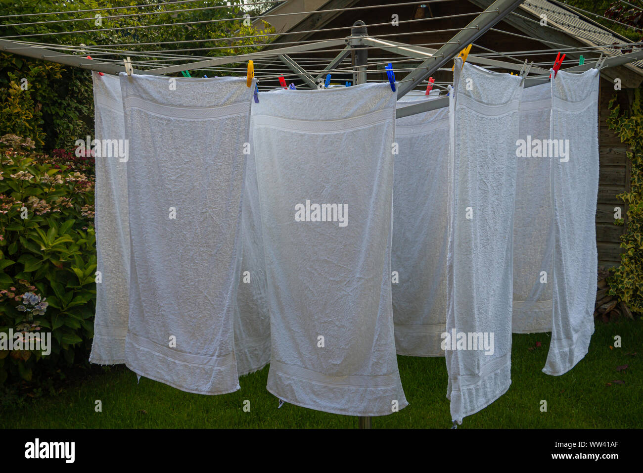 Drying your white laundry towels in the wind outside on the clothes line in summertime picture taken in the Netherlands Stock Photo Alamy