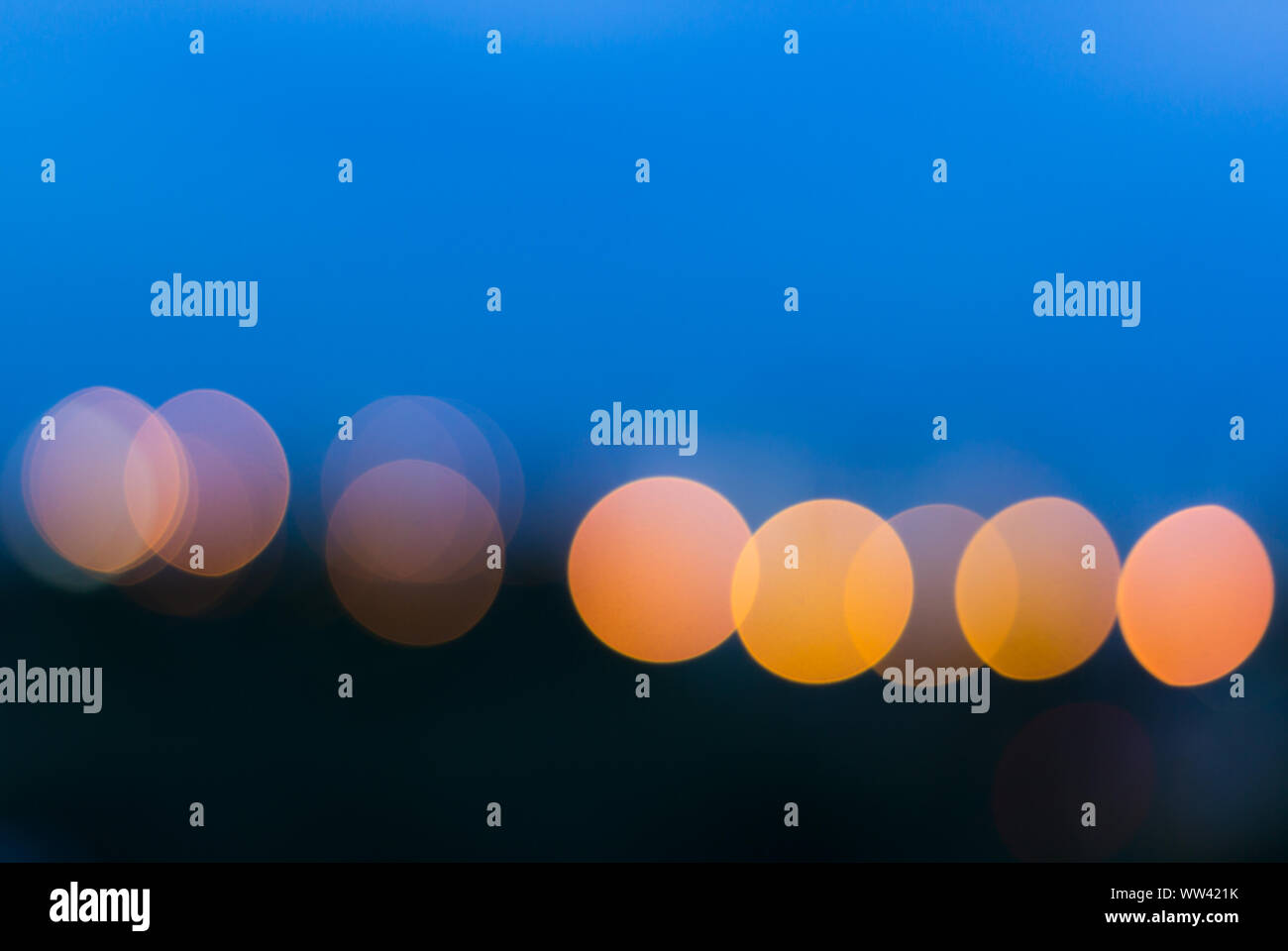 City light blur circle bokeh on blue background Stock Photo - Alamy