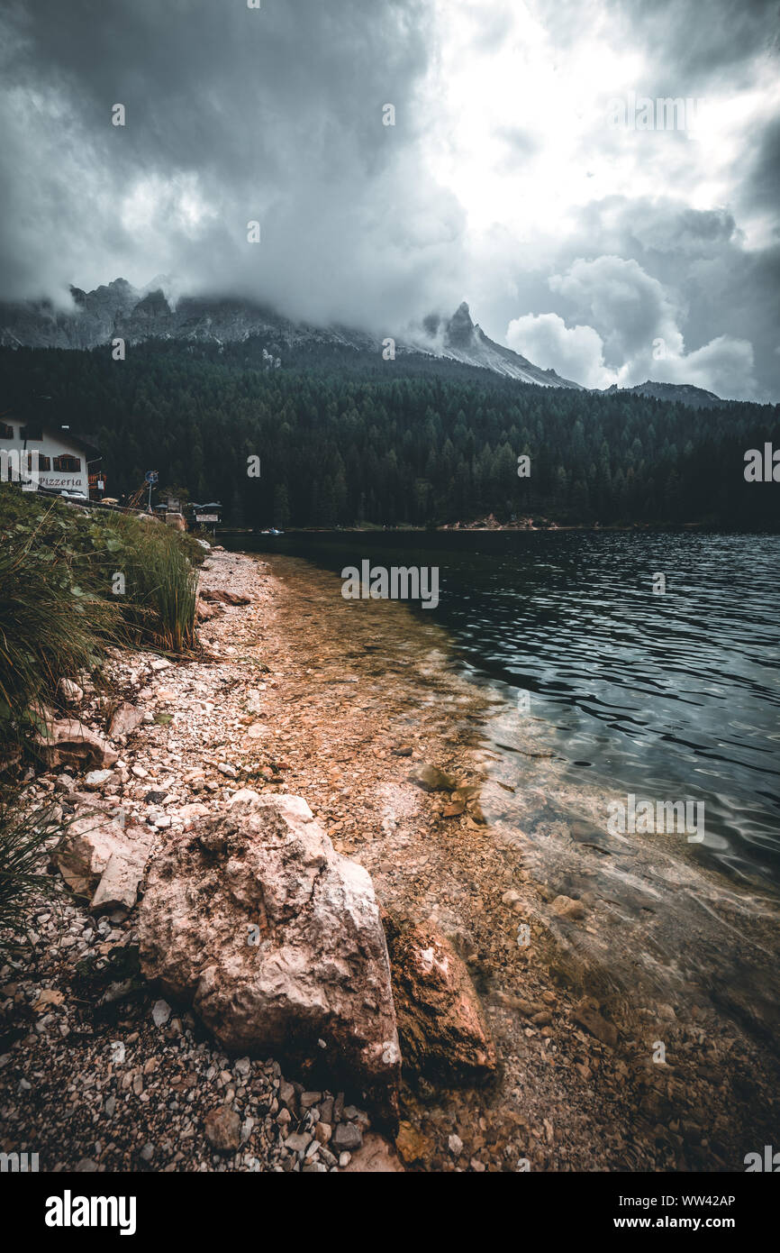 Great view of the foggy lake Antorno in National Park Tre Cime di ...