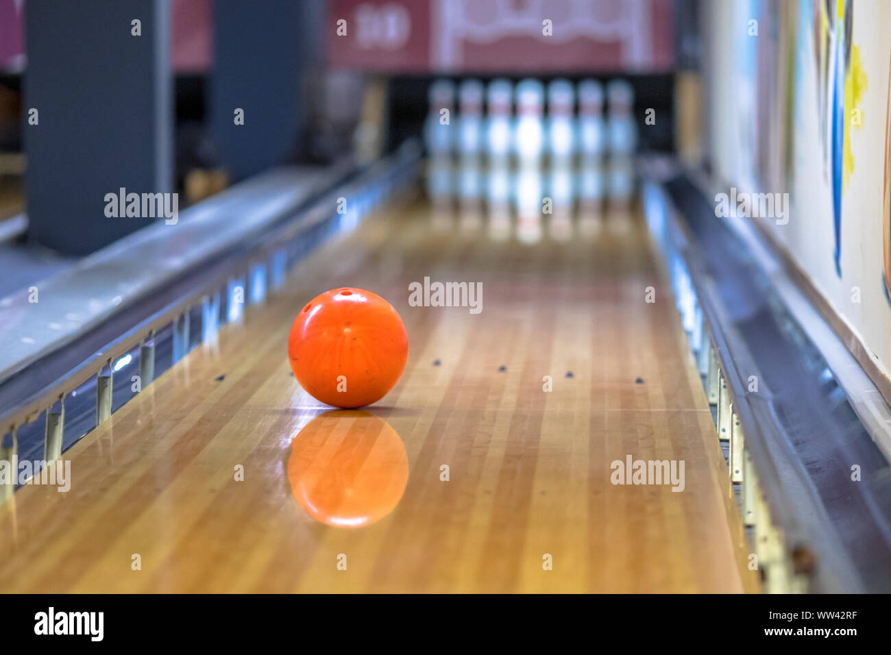 Bowling ball on alley in indoor bowling club Stock Photo