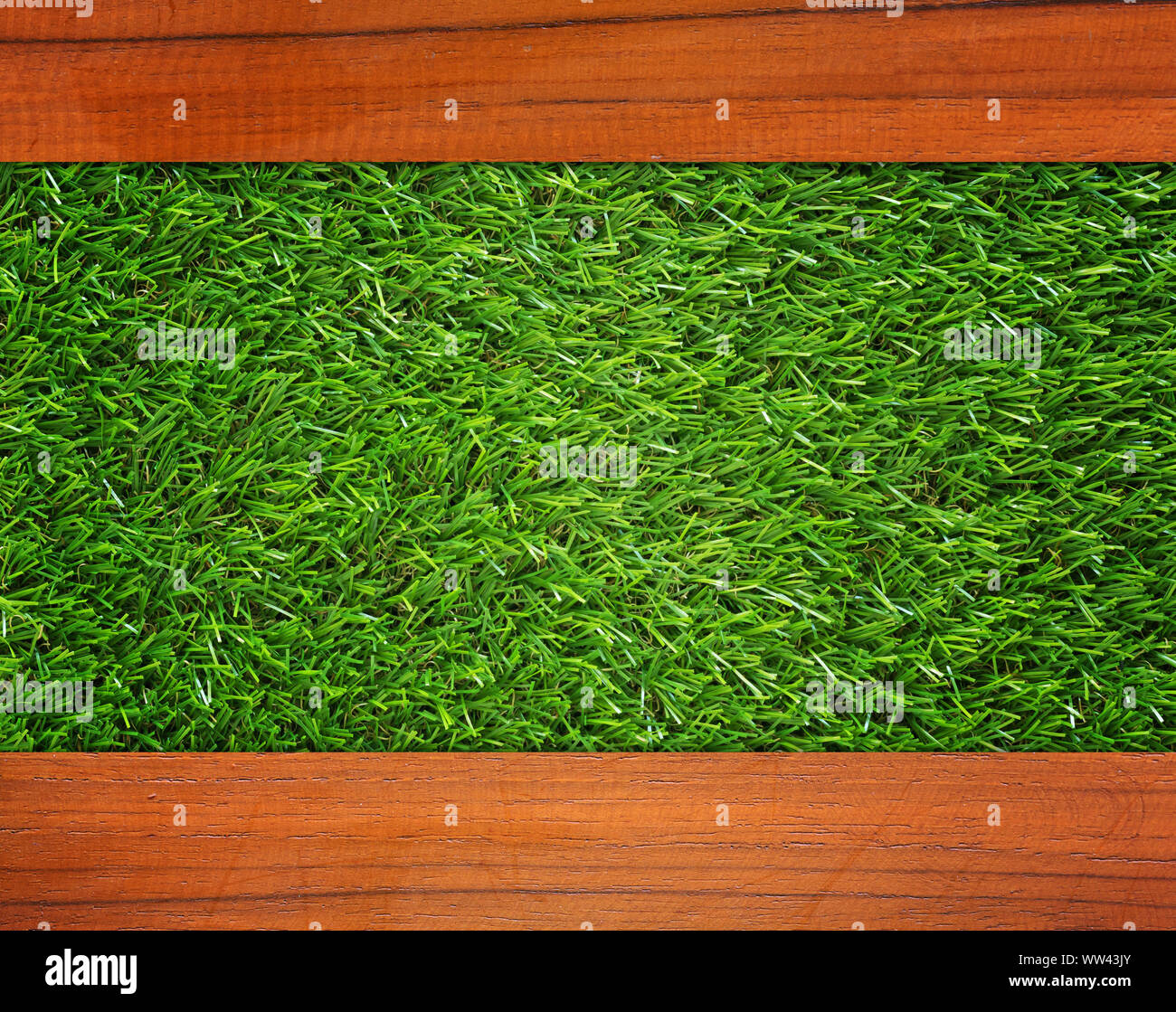 Wood plank on green grass texture background Stock Photo - Alamy