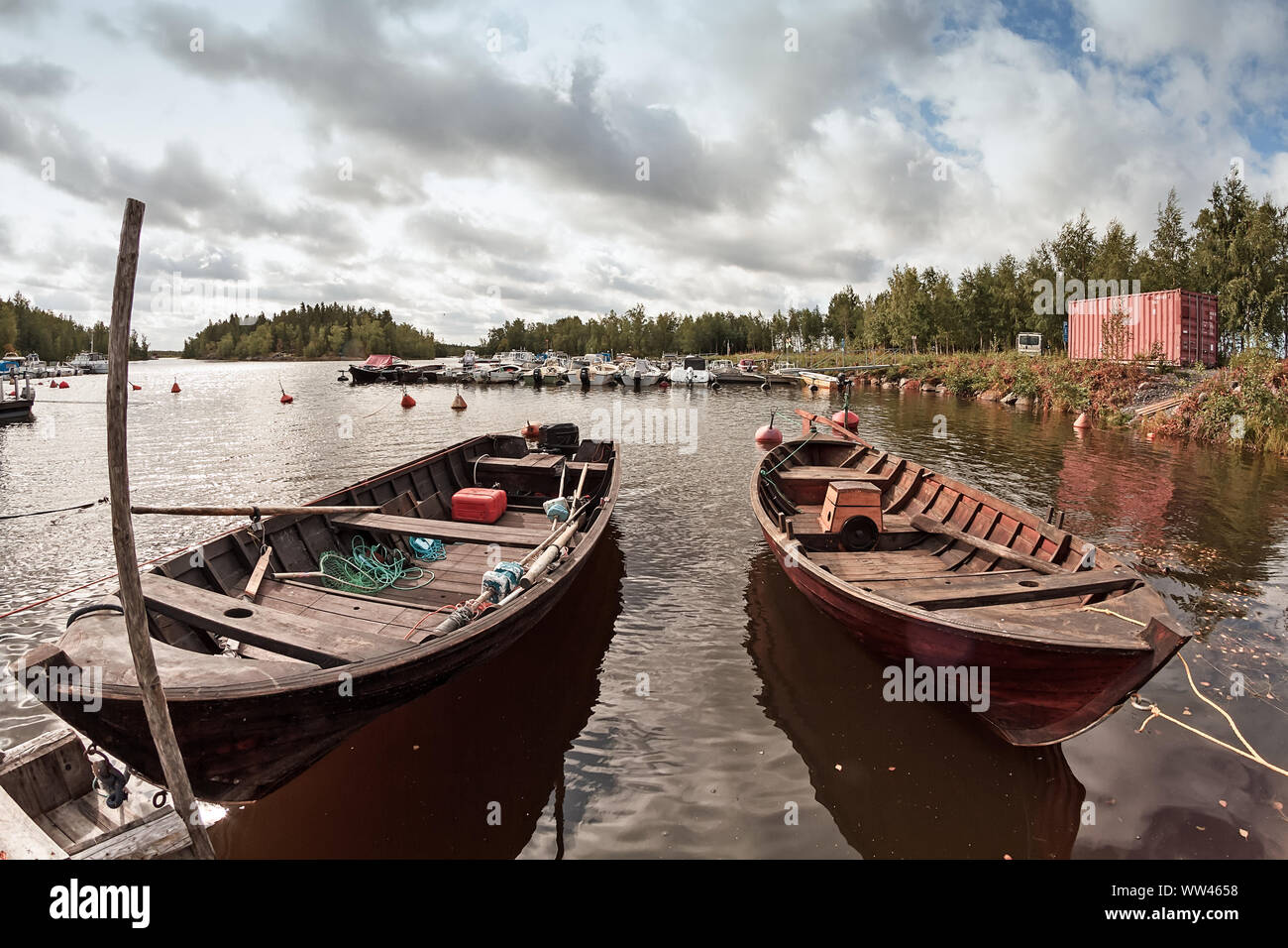 Two old wooden fishing boats wait for the fishermen at the harbour of  Kalajoki, Finland. These traditional fishing boats are actually used on sea  Stock Photo - Alamy