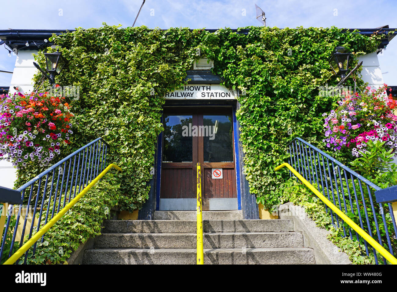 HOWTH, IRELAND -27 JUL 2019- View of the DART train station (Binn Eadair Howth) in the town of Howth, a fishing village and waterfront suburb of Dubli Stock Photo