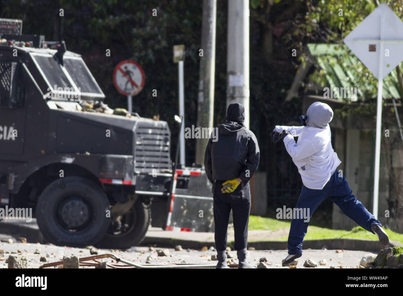 June 4, 2019: Hooded men throw stones at the riots of the La Macarena District University. In the national strike in protest of the defense of the life and physical integrity of teachers, social and union leaders, and the rejection of all forms of violence that are evident in the country. Credit: Daniel Garzon Herazo/ZUMA Wire/Alamy Live News Stock Photo