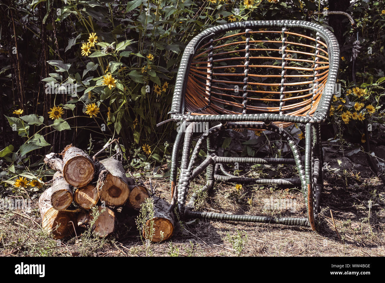 Rocking chair in the open air. Wicker chairs for relaxing. Stock Photo