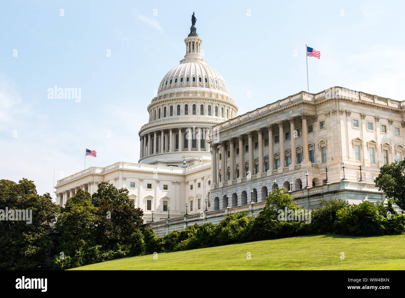 Side view of the U.S. Capitol Building, home of Congress, and located atop Capitol Hill at the eastern end of the National Mall in Washington, D.C. Stock Photo