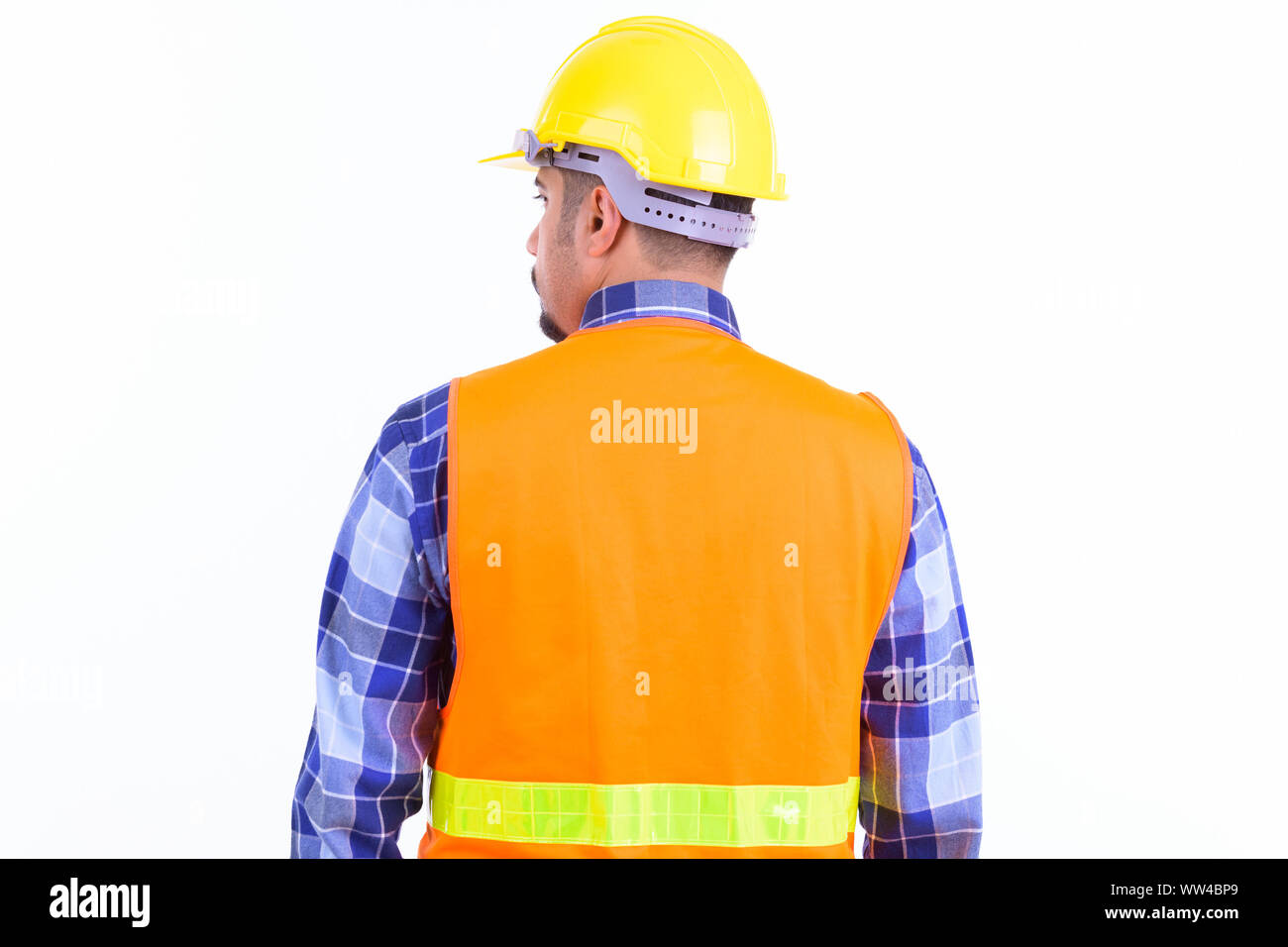 Rear view of bearded Persian man construction worker Stock Photo