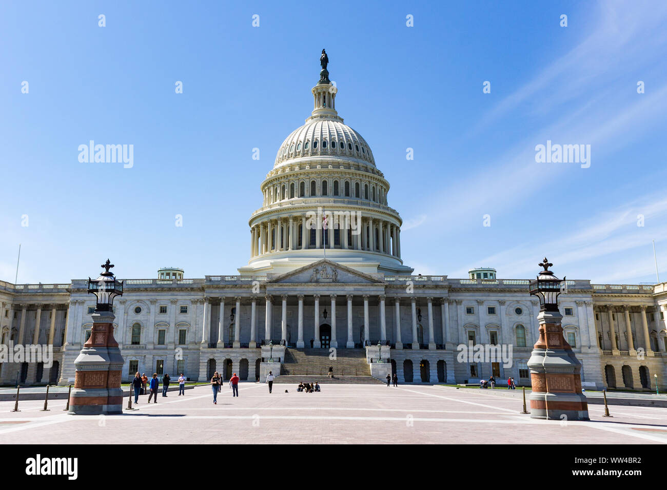 People visit the East Front of the U.S. Capitol building.  The Capitol Building is the home of the U.S. Congress. Stock Photo