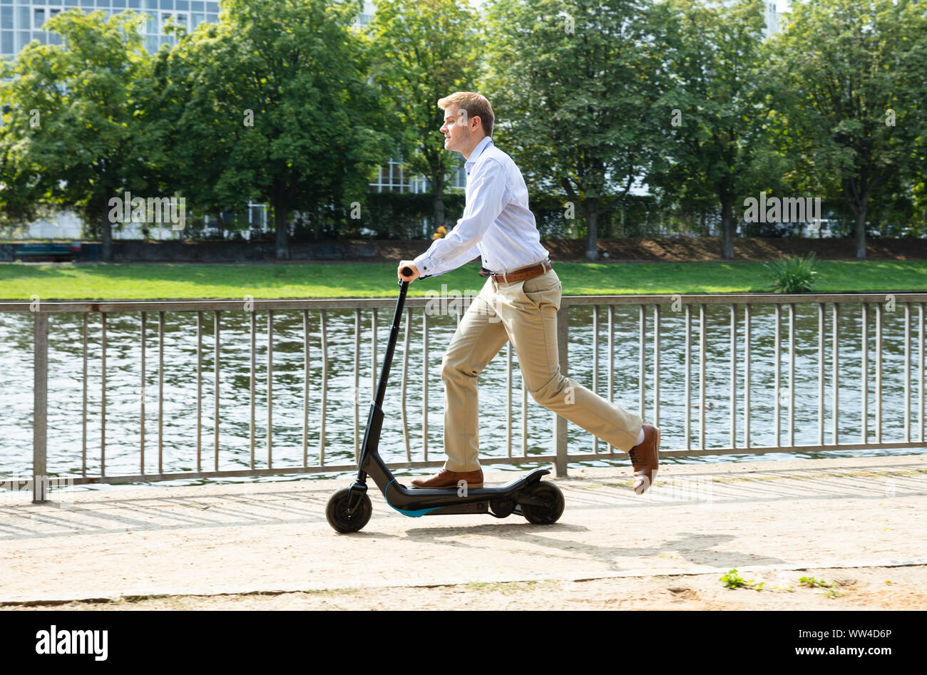 Young man e scooter hi-res stock photography and images - Alamy