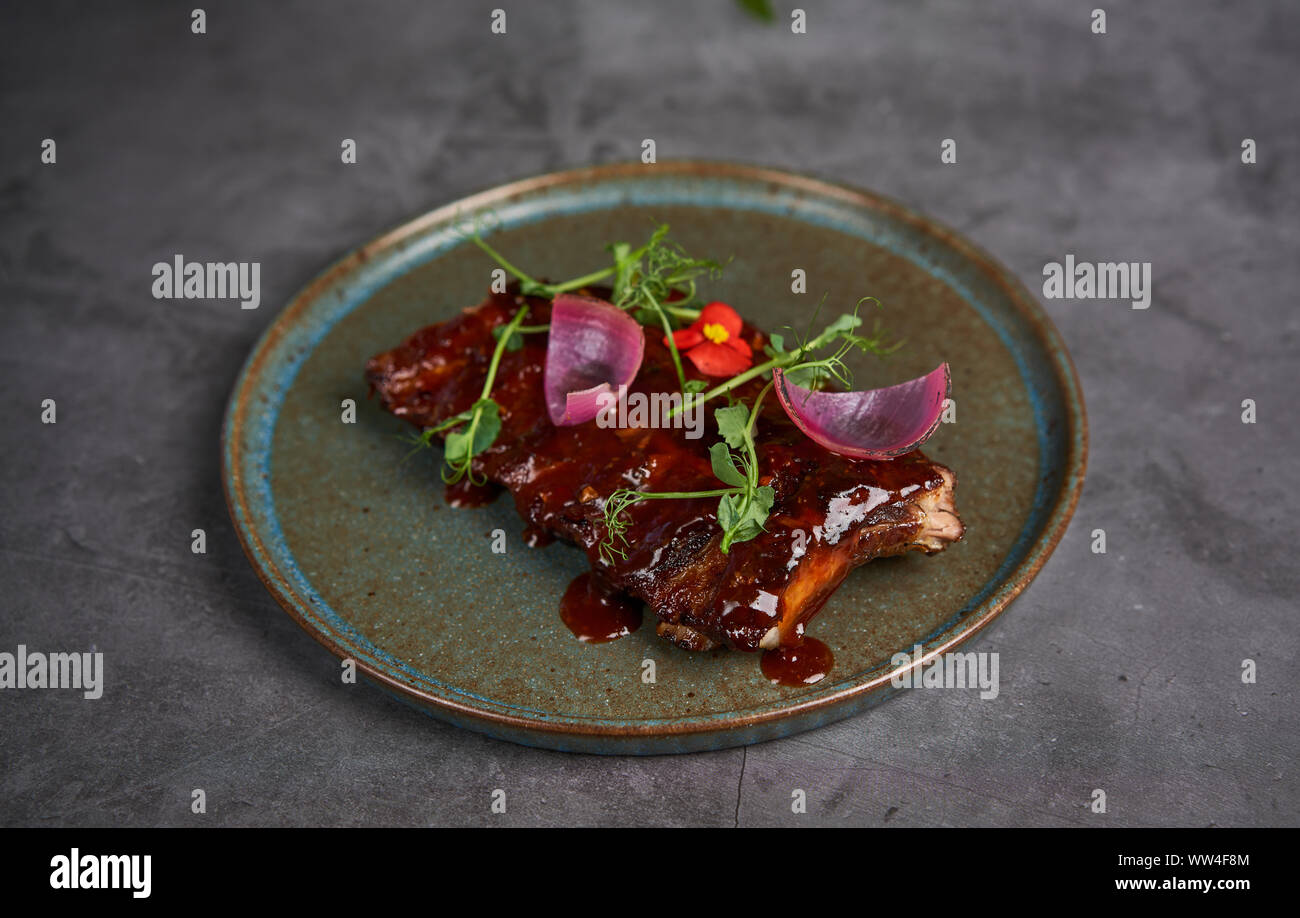 delicious ribs with sauce on a plate Stock Photo
